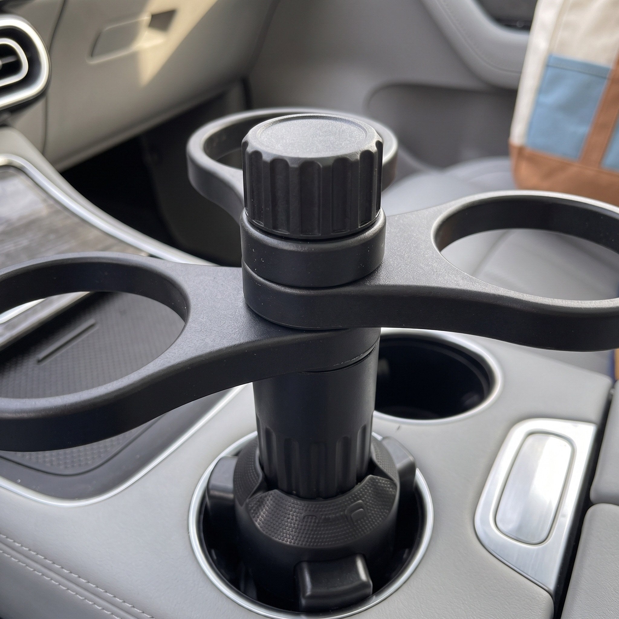 Close view of the black ribbed knob and rings