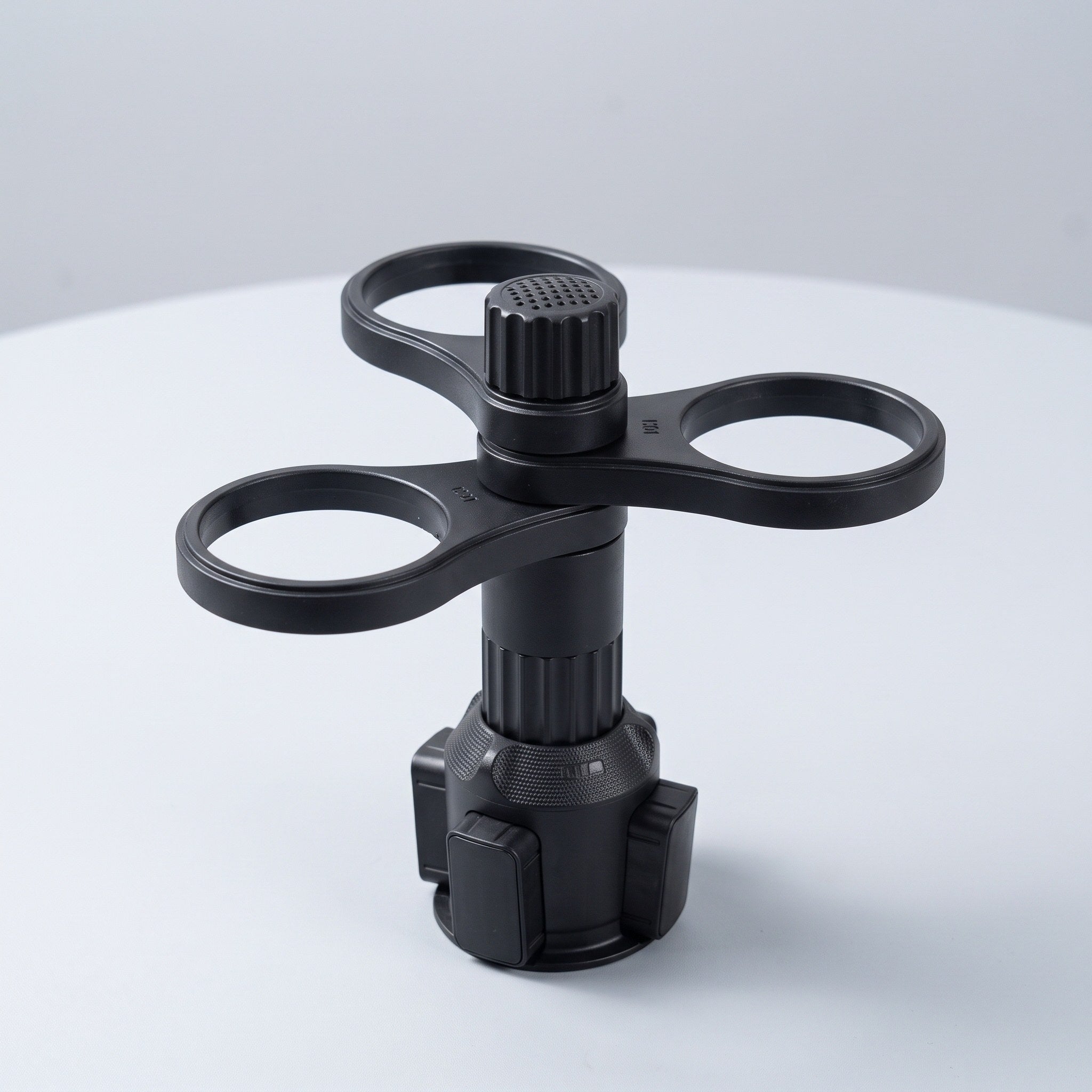 Empty black holder with three circular cup arms