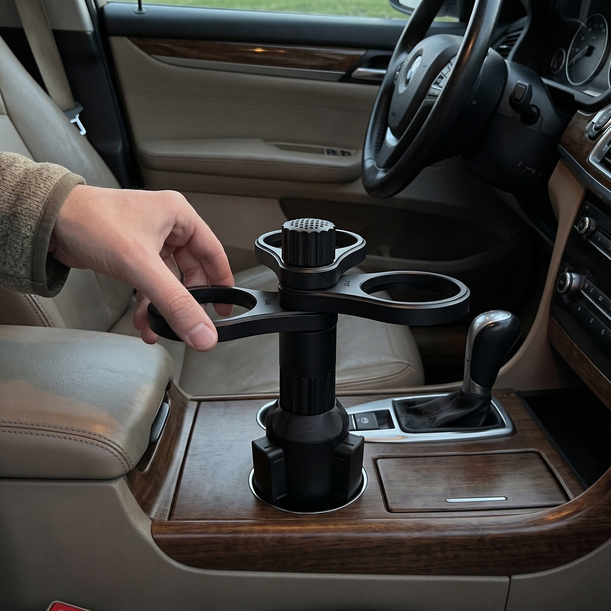 Fingertips rotate an empty ring with the holder anchored in a round recess
