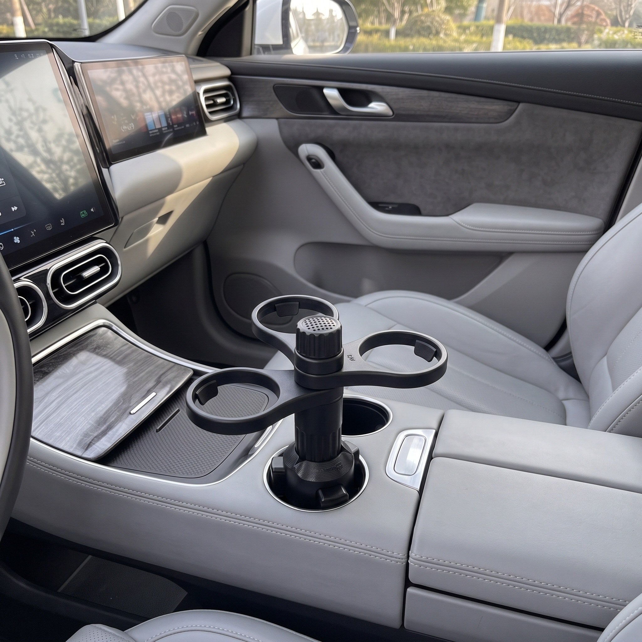 Three empty rings positioned clear of the handbrake in a parked car